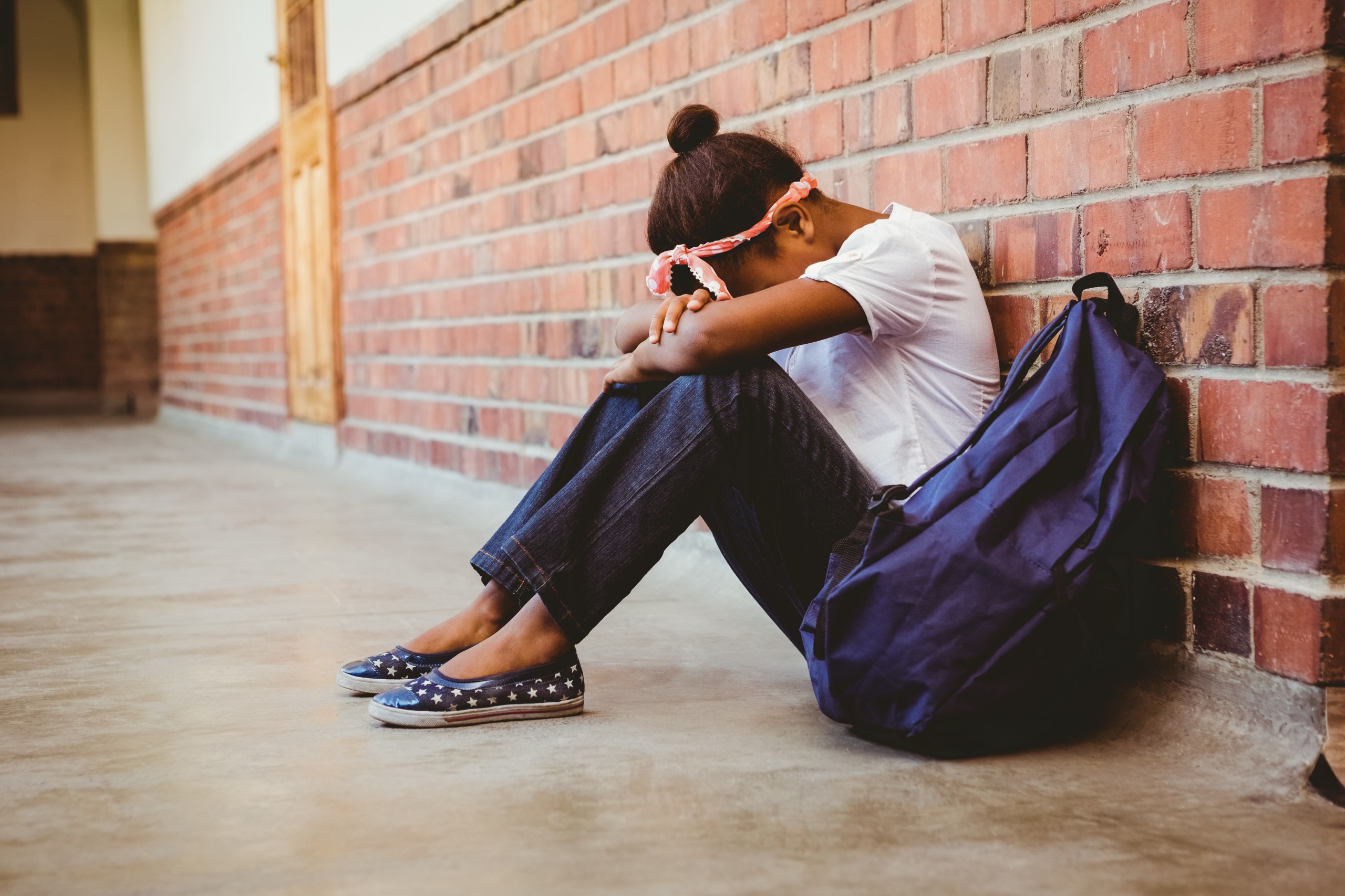 Girl sad in hallway