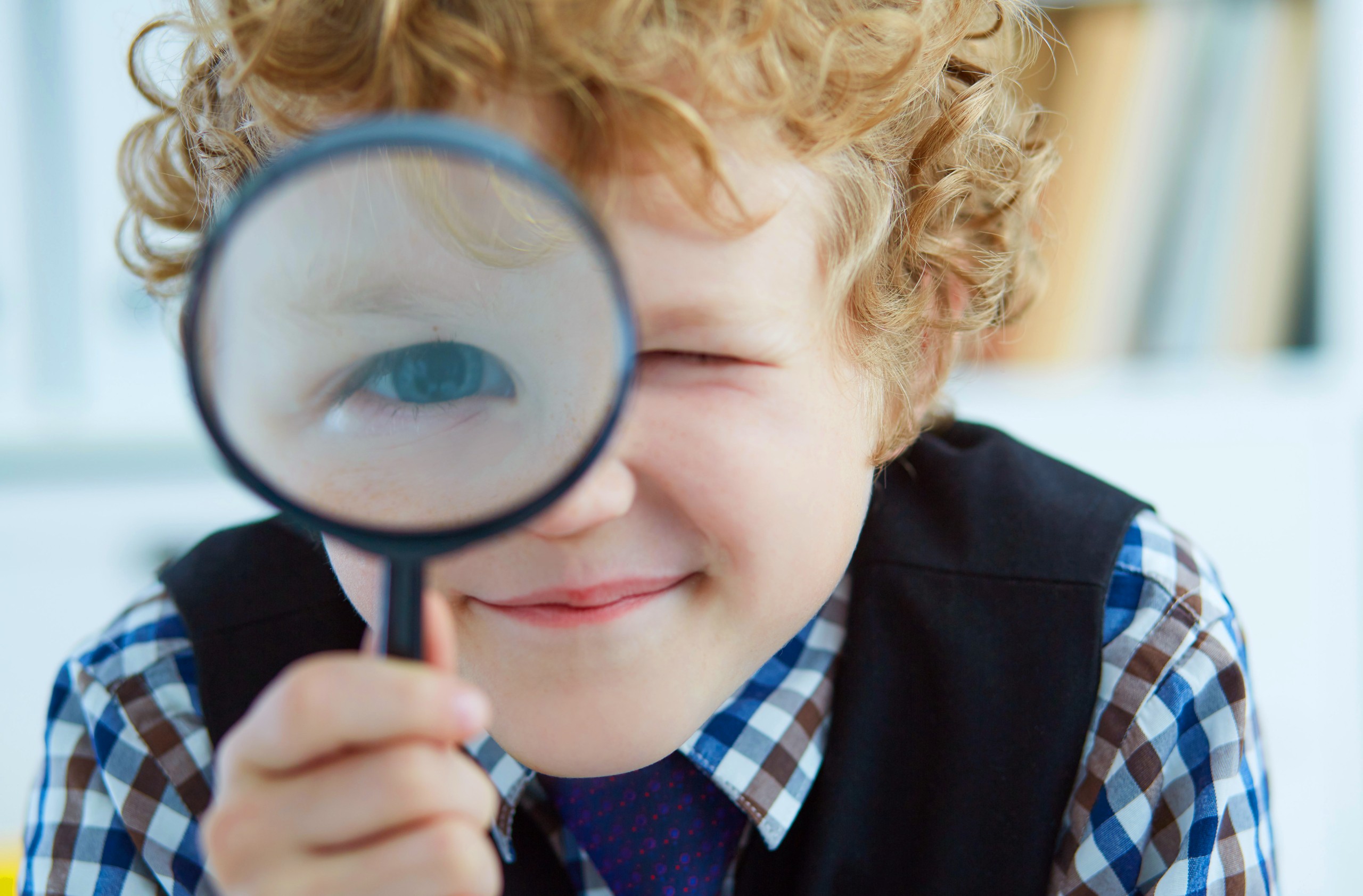 Boy magnifying glass