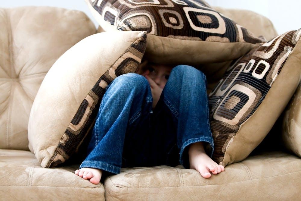 Child in cushions